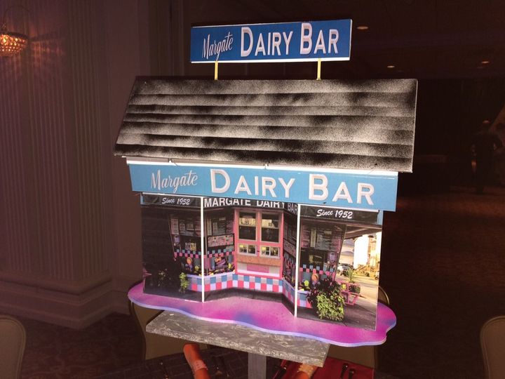 A dairy bar with a sign on top of it